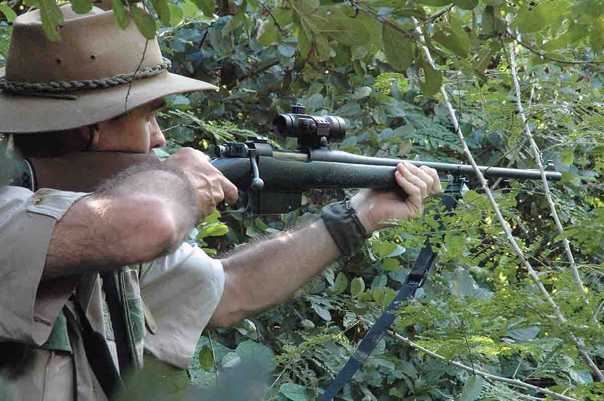 Thick cover is the traditional place where you want stopping power. Ganyana prefers the speed of an accurate shot, so he often uses an optical sight.